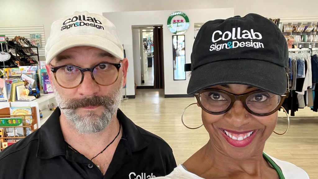 Matt and Peppur wear black and white Collab Sign and Design hats
