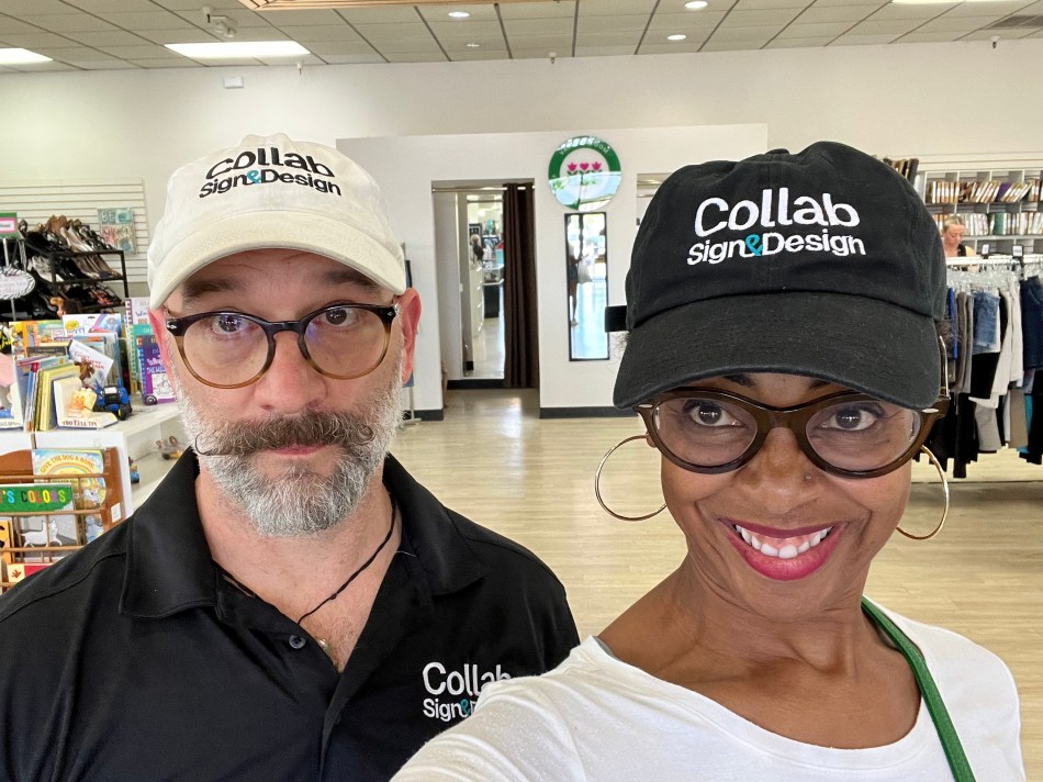 Matt and Peppur wear black and white Collab Sign and Design hats